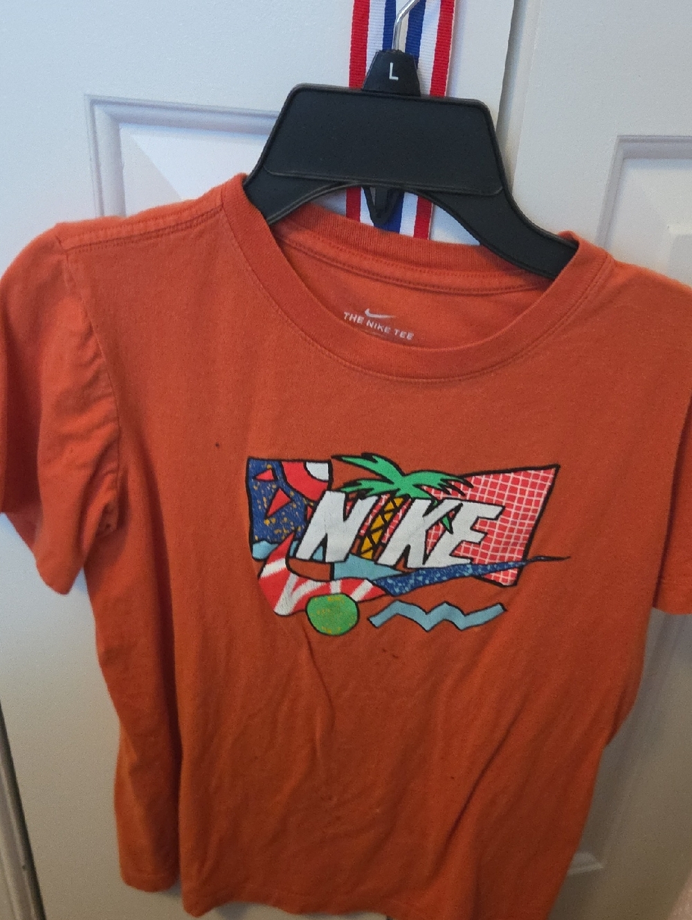 Nike Kids Orange Graphic Tee with Tropical Logo